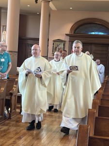 Monsignor Roger Landry, first on the left, processes into the Basilica of St. Louis, King of France (Old Cathedral), in St. Louis, Missouri, during a TPMS Midwest Regional Meeting on March 25, 2025, Solemnity of the Annunciation of the Lord.